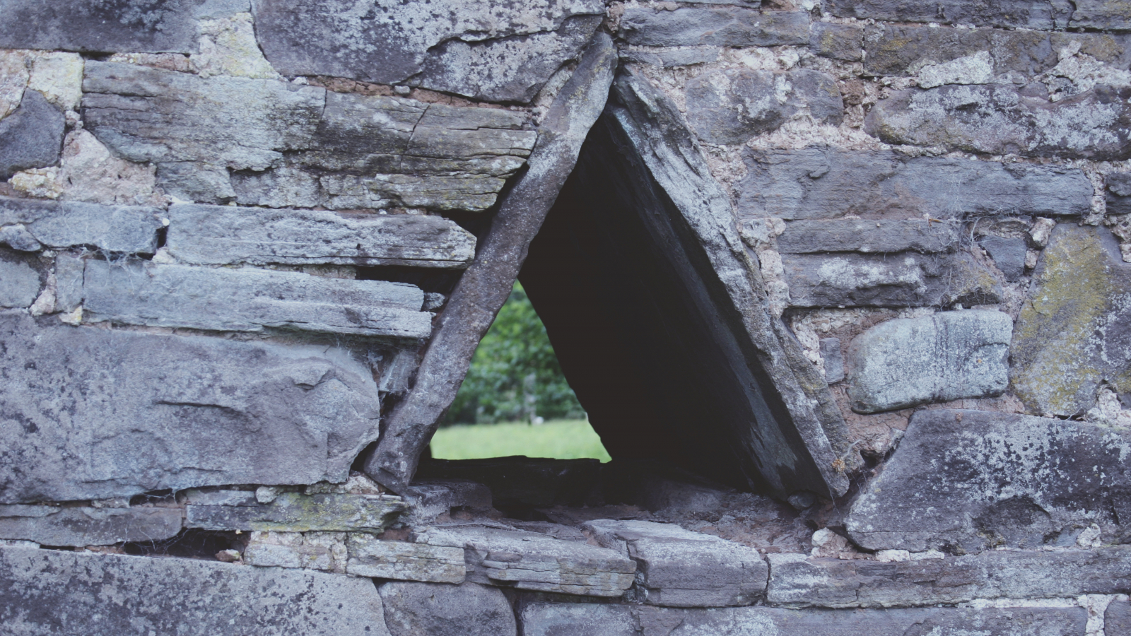 Stone wall with triangular hole
